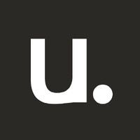 White stylized U-shaped logo with a separate circular dot on a dark charcoal square background.